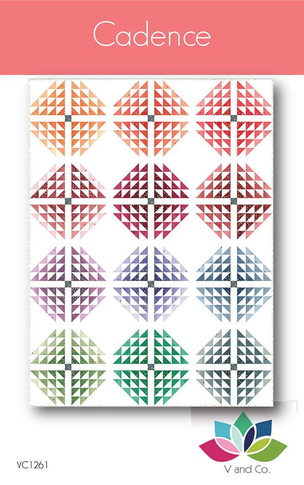 Photo: Rectangular quilt of 12 diamond blocks (each made out of numerous small triangles, all pointing toward the center and in shades of the same color)