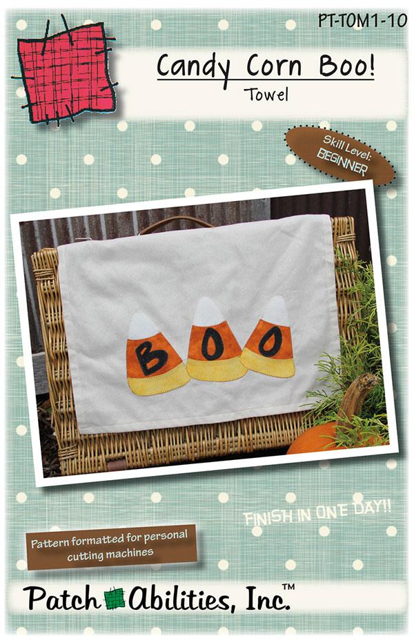 Photo: white towel with three large candy corn, each with a black letter spelling B-O-O. Skill level: Beginner