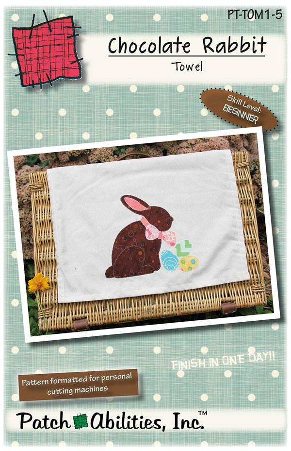 Photo: white towel with an image of a brown rabbit with a pink bow and three Easter eggs. Skill level: Beginner